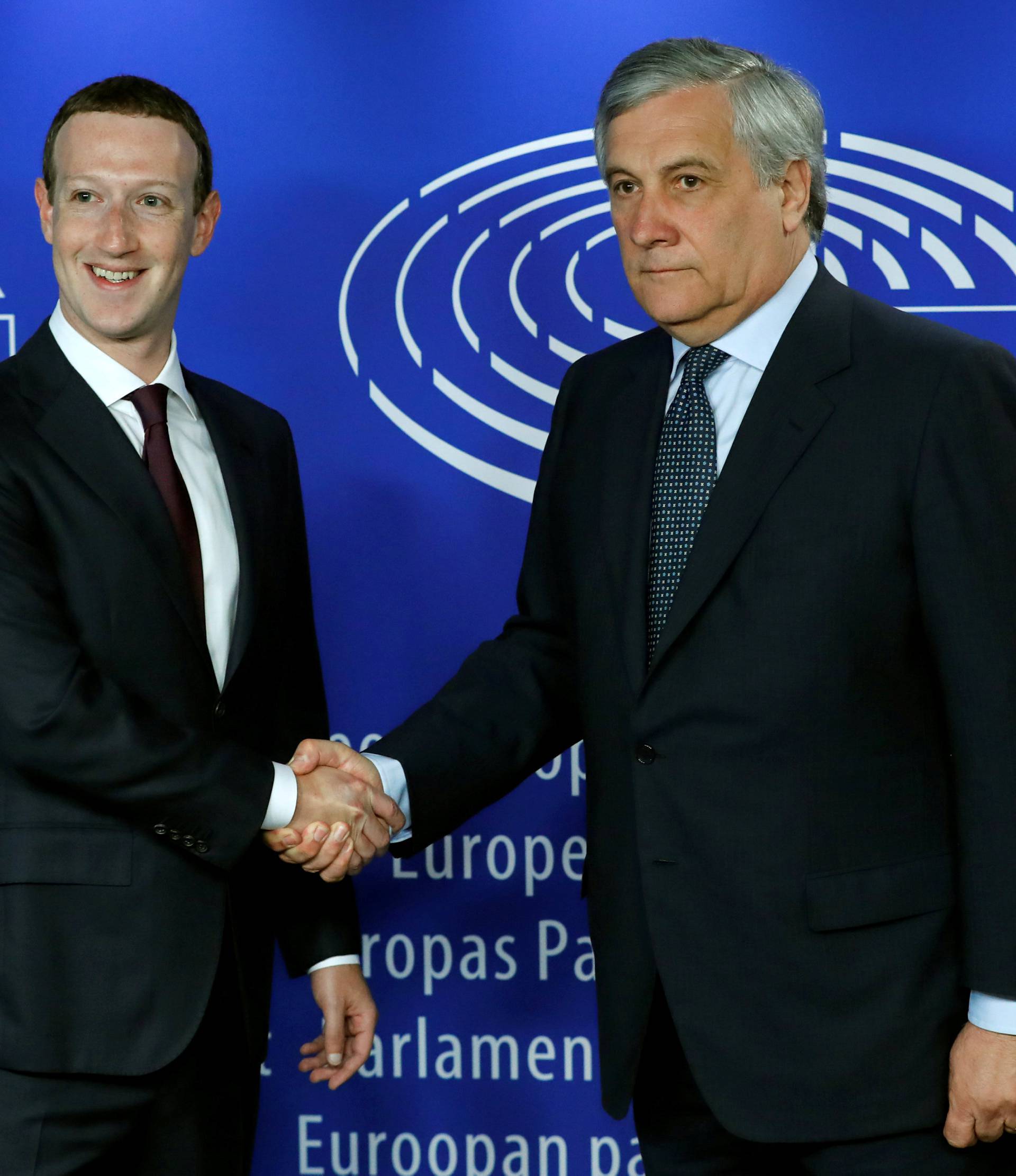 Facebook's CEO Mark Zuckerberg shakes hands with European Parliament President Antonio Tajani at the European Parliament, in Brussels