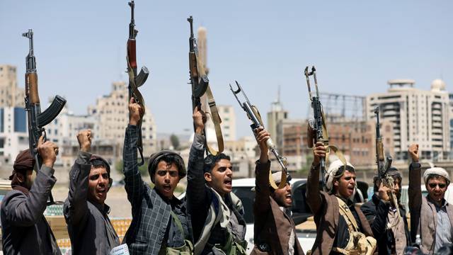 FILE PHOTO: Houthi followers attend a gathering to receive food supplies from tribesmen in Sanaa