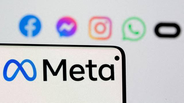 FILE PHOTO: Facebook's new rebrand logo Meta is seen on smartphone in this illustration picture