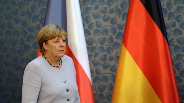 Merkel arrives at a news conference at Czech government headquarters in Prague