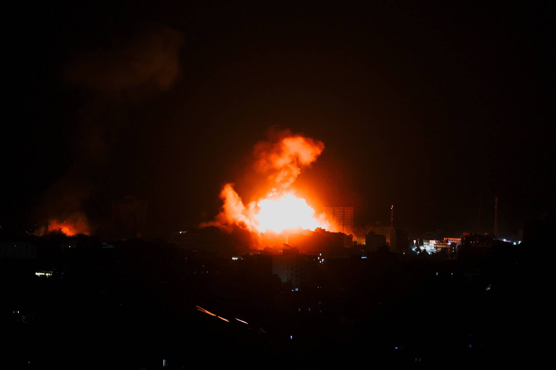 Flames and smoke billow during Israeli strikes in Gaza