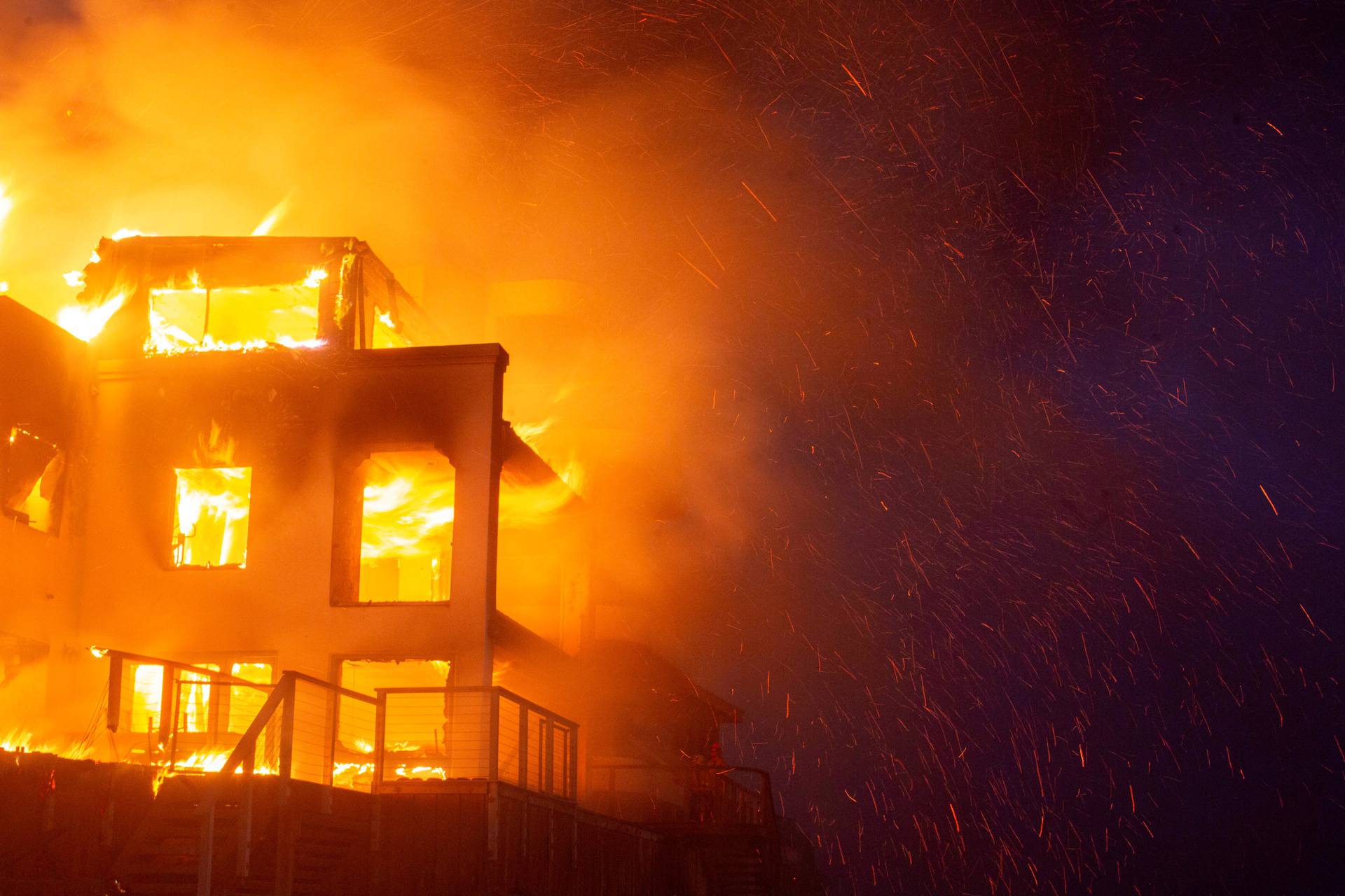 Palisades fire burns during a windstorm on the west side of Los Angeles