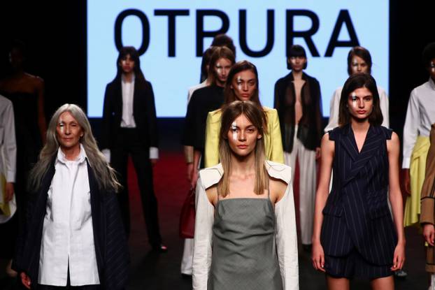 Models display outfits from Otrura fashion house in Madrid