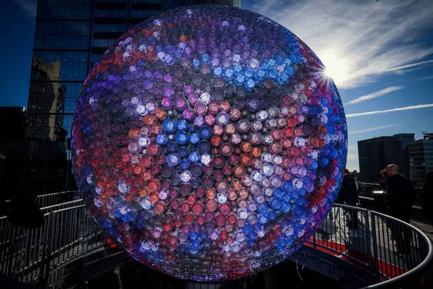 A newly created New Year's eve ball is raised for the first time above One Times Square ahead of the New Year's Eve ball drop in New York