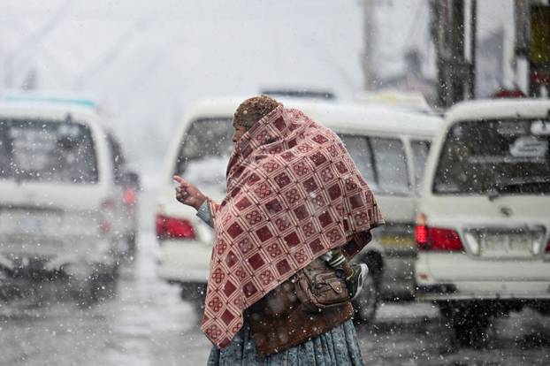 Snow falls amid low temperatures in Bolivia, in El Alto