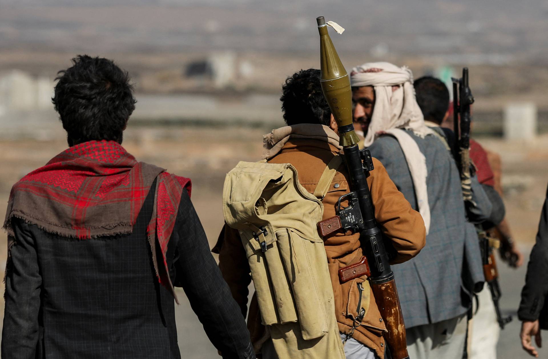 Houthi tribesmen gather to show defiance after U.S. and U.K air strikes on Houthi positions near Sanaa