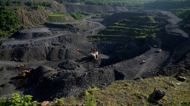 FILE PHOTO: Heavy equipment excavate anthracite coal from a strip mine in New Castle, Pennsylvania