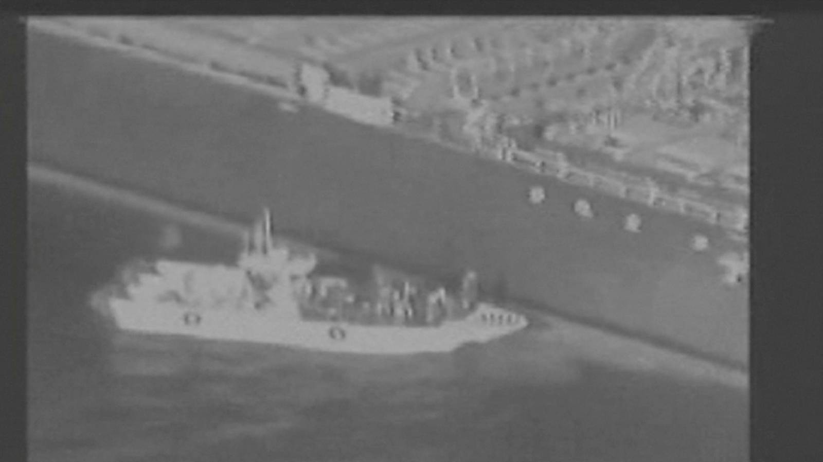 Still image taken from a U.S. military handout video purports to show Iran's Revolutionary Guard (IRGC) removing an unexploded limpet mine from the side of the Kokuka Courageous Tanker