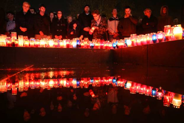 Bosnian Croats pray and light candles for the convicted general Slobodan Praljak who killed himself seconds after the verdict in the U.N. war crimes tribunal in The Hague, in Mostar