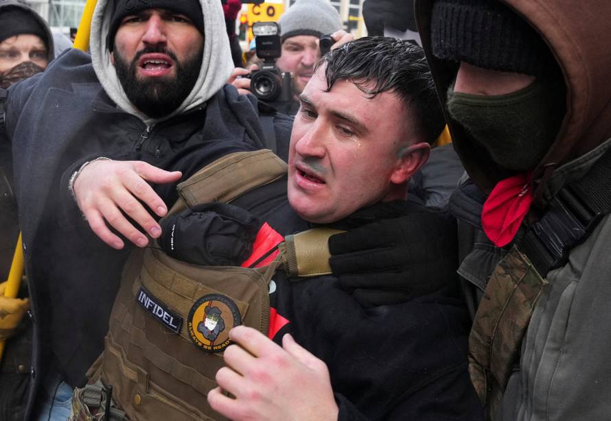 People attend the "March Against Minnesota Fraud" in Minneapolis