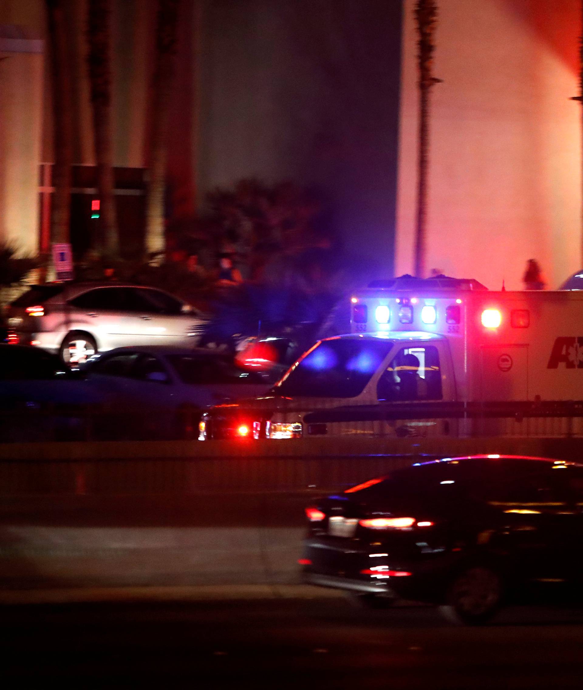 An ambulance heads to a hospital after a mass shooting at a music festival on the Las Vegas Strip in Las Vegas
