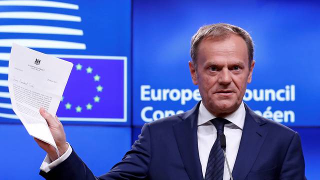 European Council President Donald Tusk shows British Prime Minister Theresa May's Brexit letter in notice of the UK's intention to leave the bloc under Article 50 of the EU's Lisbon Treaty, at the end of a news conference in Brussels