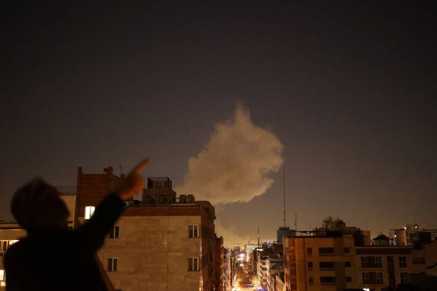 Smoke rises following an explosion, after Israel and the U.S. launched strikes on Iran, in Tehran
