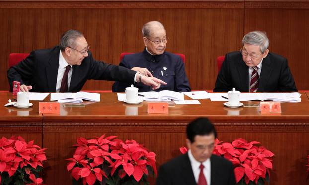 FILE PHOTO: China's former vice premier Li Lanqing speaks to former premier Zhu Rongji as Hu Jintao, China's president and general secretary of the Communist Party of China, delivers a speech in Beijing