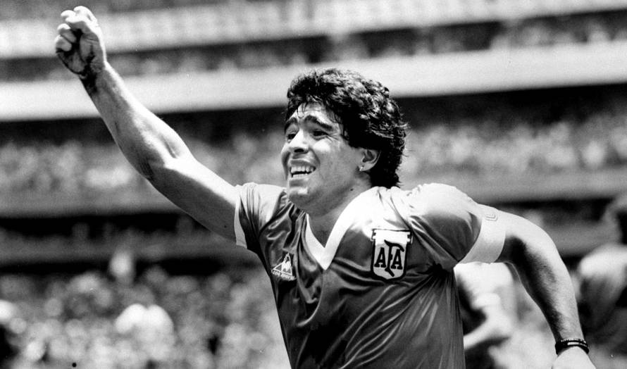 FILE PHOTO:  Argentinian star Diego Maradona raises his arm in the air after scoring