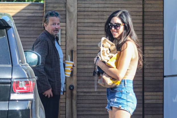 *EXCLUSIVE* Matthew Perry appears much thinner as he visits a friend with a mystery lady - ** WEB MUST CALL FOR PRICING **