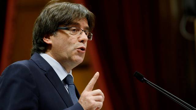 FILE PHOTO - Puigdemont speaks during a confidence vote session at Catalan Parliament in Barcelona