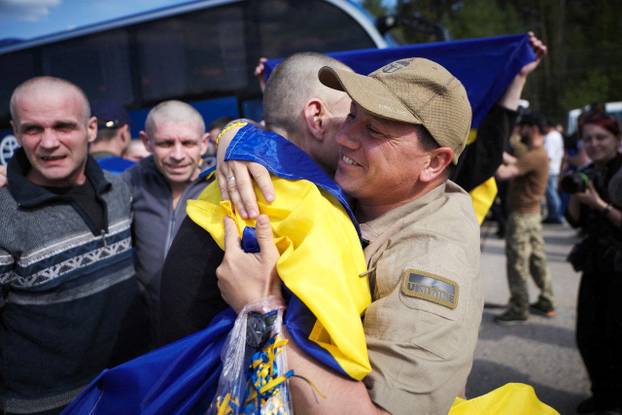 Ukrainian POWs are seen after a swap at an unknown location in Ukraine