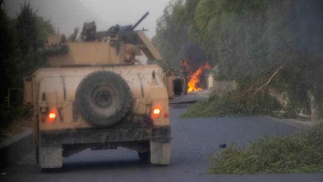 FILE PHOTO: Humvees that belong to Afghan Special Forces are seen destroyed during heavy clashes with Taliban during the rescue mission of a police officer besieged at a check post, in Kandahar province