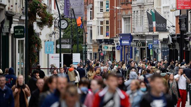 FILE PHOTO: People walk in a busy retail street in Dublin, Ireland