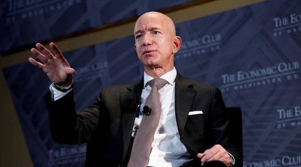 FILE PHOTO: Jeff Bezos, president and CEO of Amazon and owner of The Washington Post, speaks at the Economic Club of Washington DC's "Milestone Celebration Dinner" in Washington