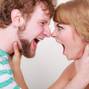 Angry woman and man yelling at each other.