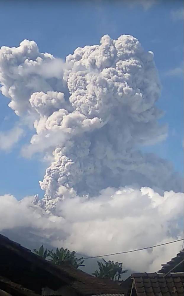 A column of ash rises following an eruption of Mount Merapi, Magelang, in Central Java