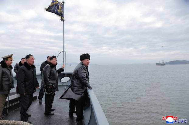 North Korean leader Kim Jong Un sails on board the Choe Hyon naval destroyer during a visit to inspect the vessel at the Nampho Shipyard