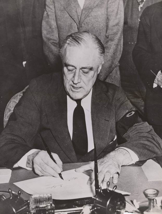 U.S. President Frankin Delano Roosevelt signs the declaration of war on Japan in Washington