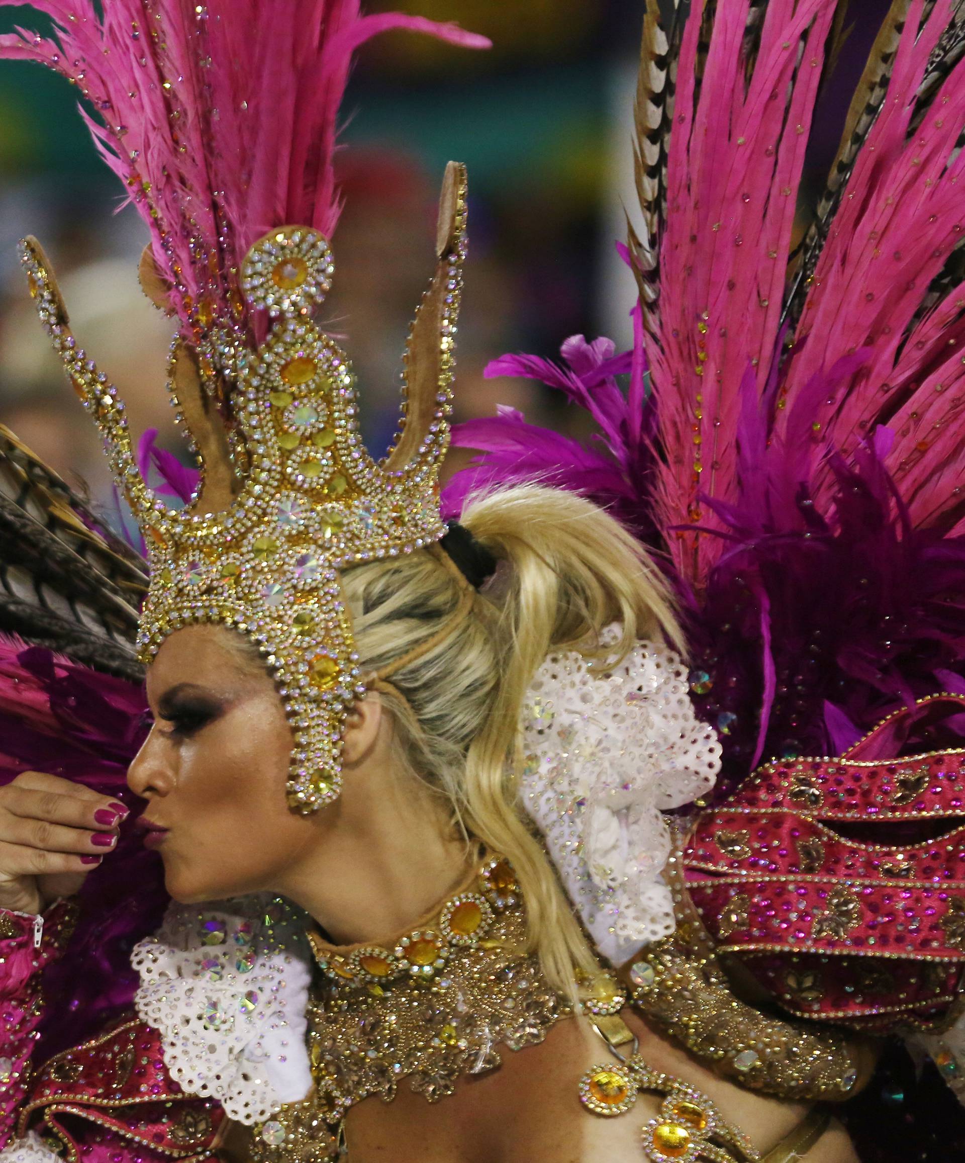 A reveller from Uniao da Ilha Samba school performs during the second night of the Carnival parade at the Sambadrome in Rio de Janeiro