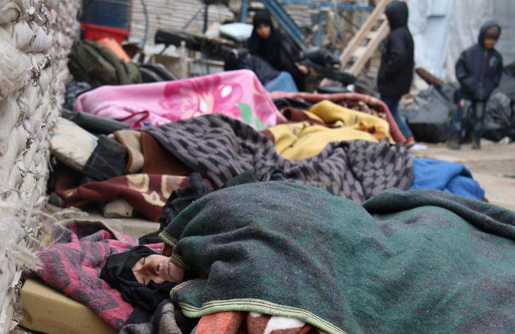 Sick people wait to be evacuated from a rebel-held sector of eastern Aleppo