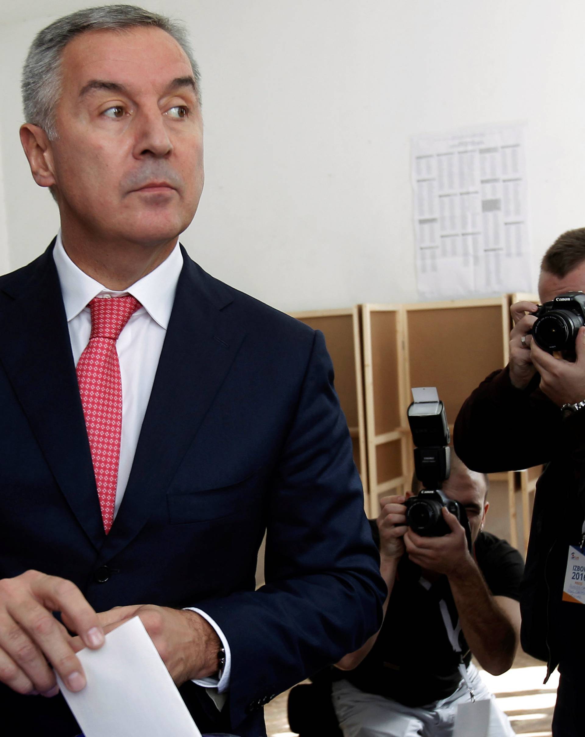 Montenegrin Prime Minister and leader of ruling Democratic Party of Socialists, Milo Djukanovic, casts his ballot at a polling station in Podgorica