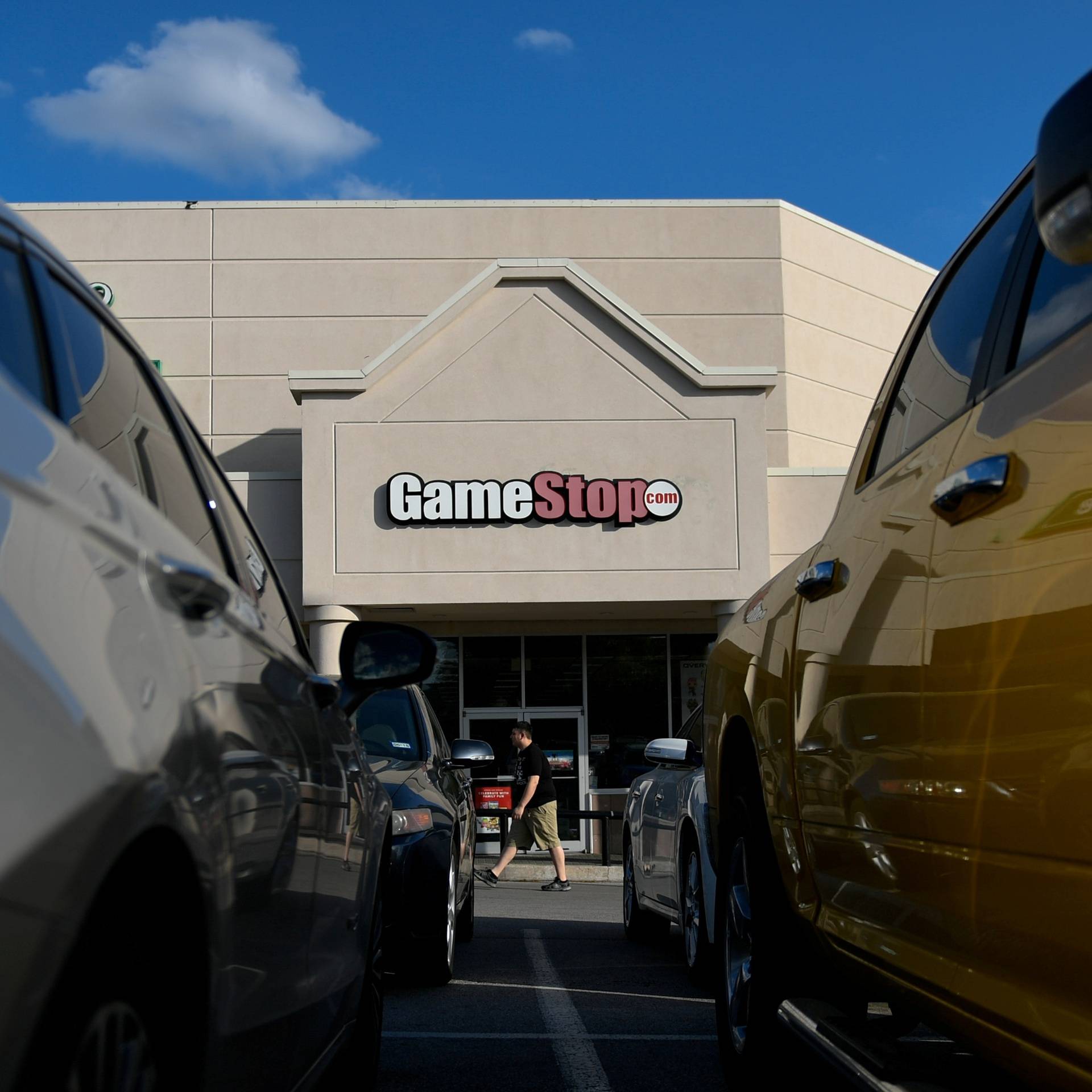 FILE PHOTO: A man walks past a GameStop store in Austin, Texas