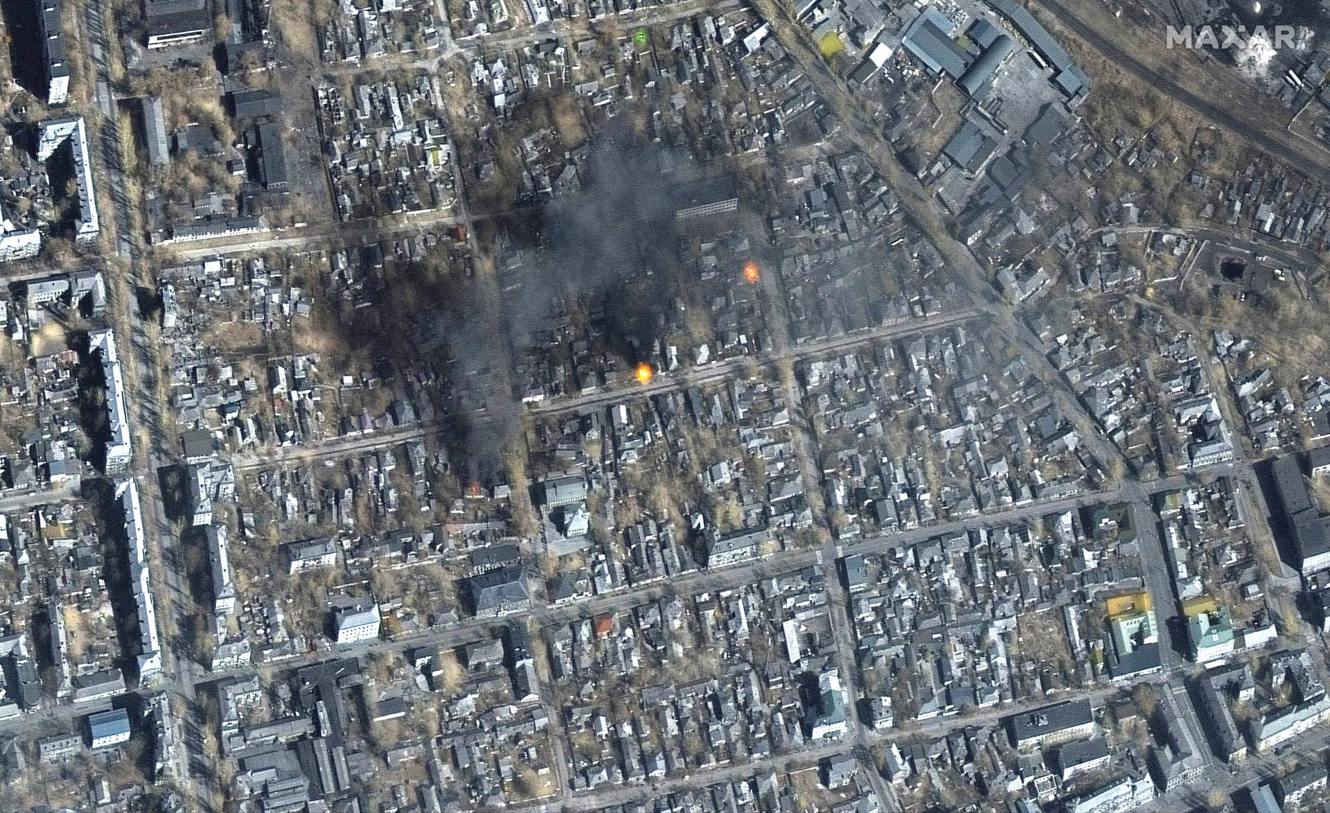 A satellite image shows a color infrared view of fires burning near Fontanna street, in eastern Mariupol