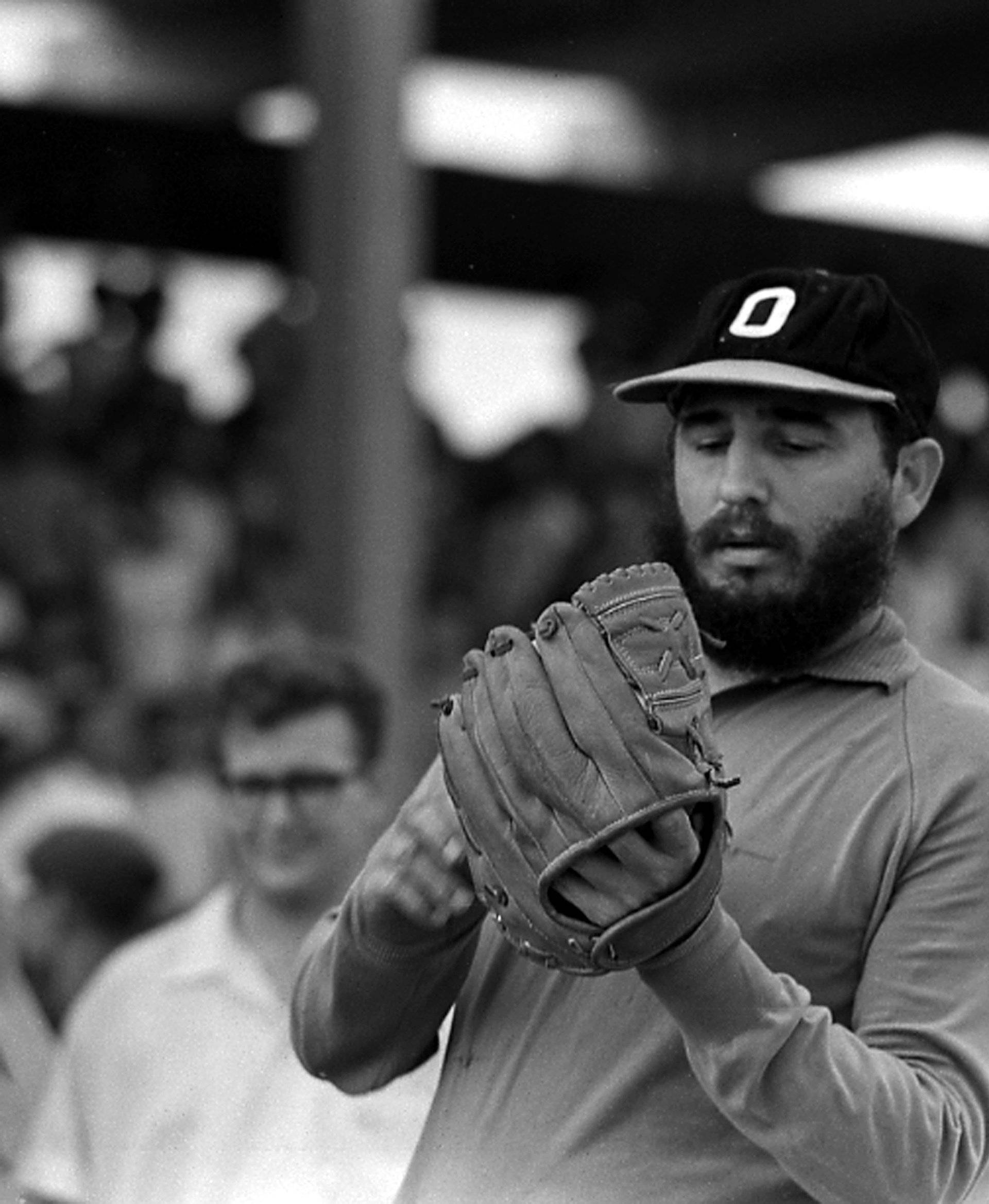 File photo of then Cuban Prime Minister Fidel Castro playing baseball in Havana