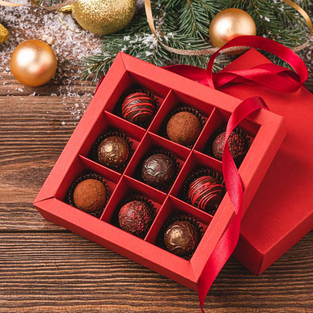 Chocolate,Candies,Red,Craft,Box,On,A,Wooden,Background,Christmas