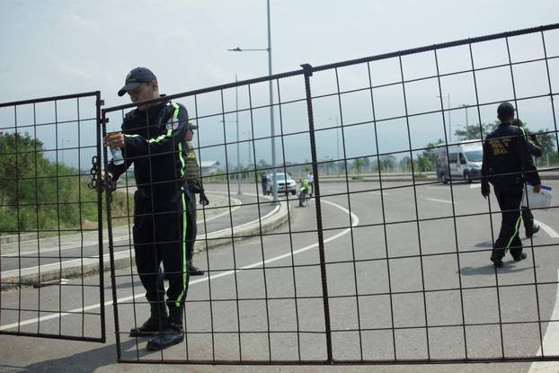 A security officer stands guard on the road to the Tienditas cross-border bridge between Colombia and Venezuela, in Cucuta