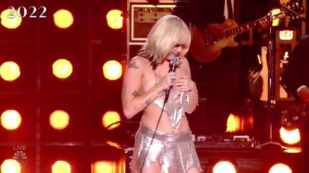 Miley Cyrus has a major wardrobe malfunction and almost exposes her boob as she performs on stage at her NBC special Miley Cyrus