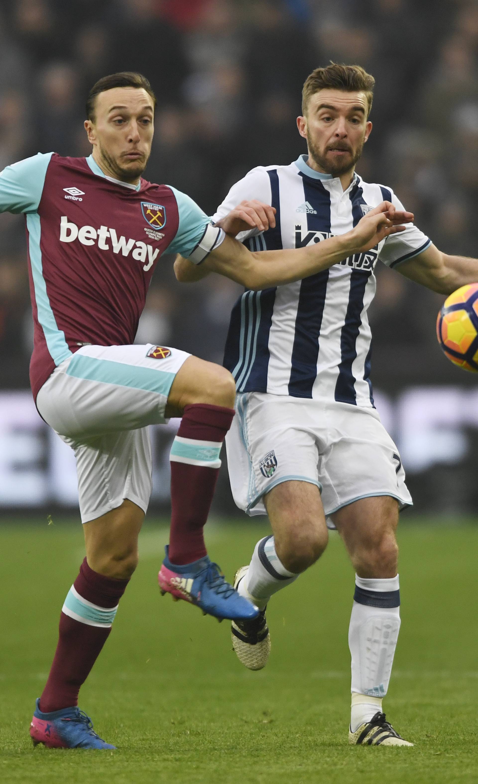 West Ham United's Mark Noble in action with West Bromwich Albion's James Morrison
