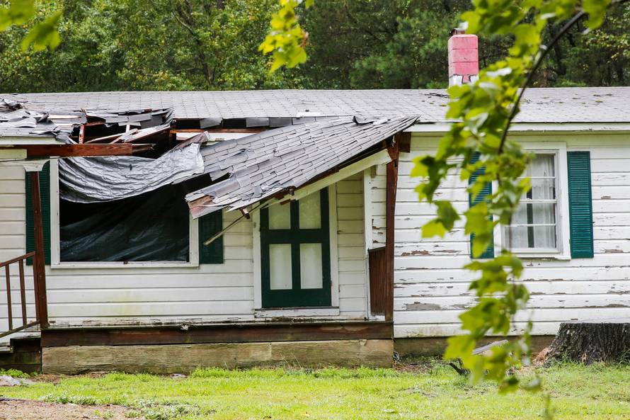 The roof of a house is seen affected by winds from Hurricane Florence as it hits the town of Wilson, North Carolina