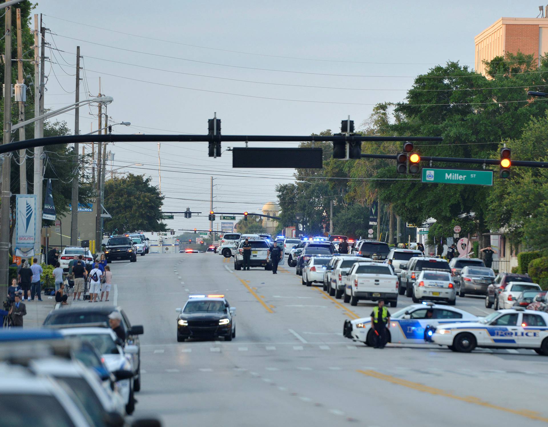 Police lock down Orange Avenue around Pulse nightclub, where people were killed by a gunman in a shooting rampage in Orlando