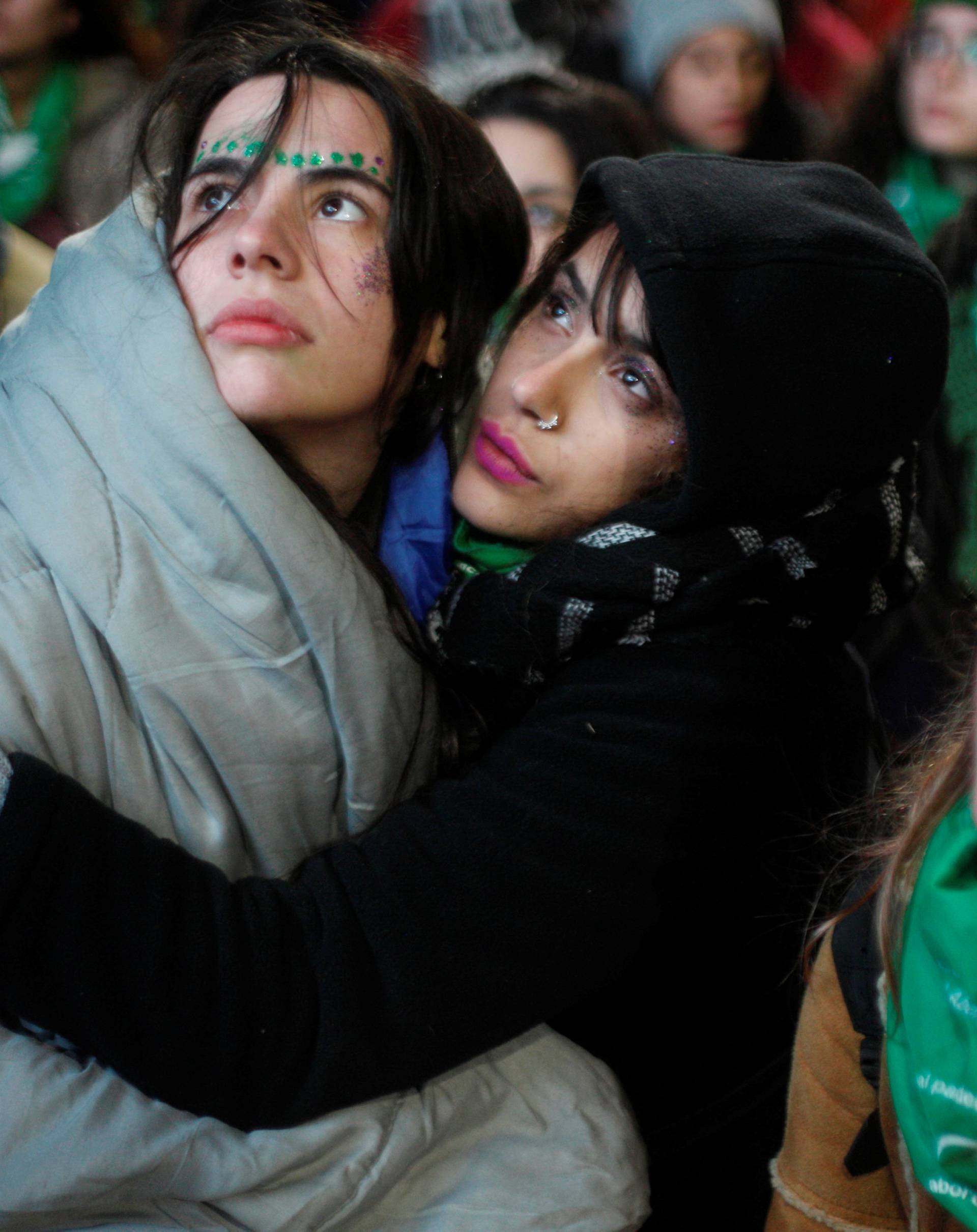 Demonstrators attend a protest in favour of legalising abortion outside the Congress while lawmakers debate an abortion bill in Buenos Aires