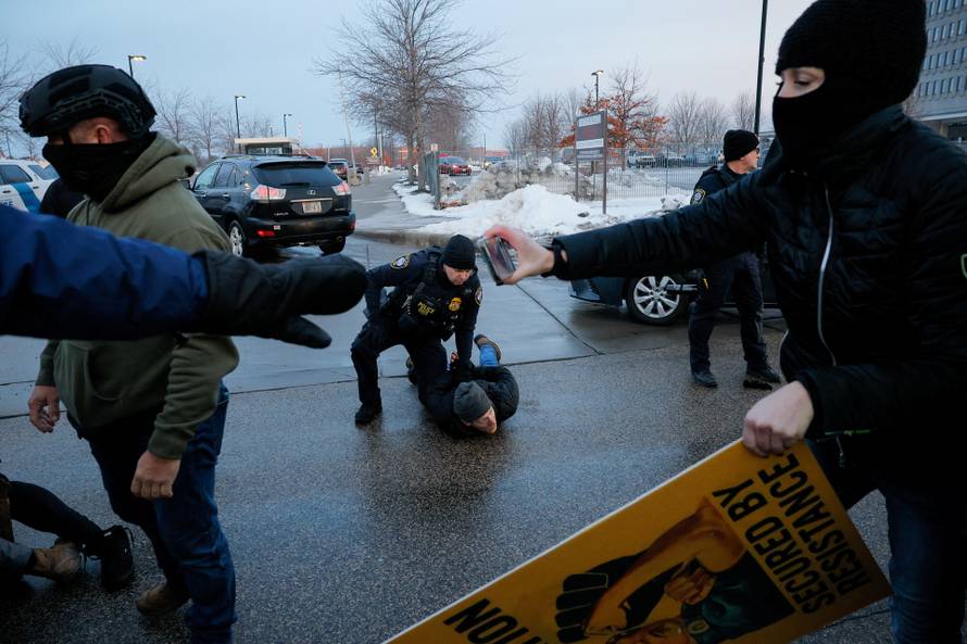 People protest against the fatal shooting of Renee Nicole Good by an ICE agent, in Minneapolis