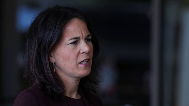 German Foreign Minister Annalena Baerbock delivers a statement at Ben Gurion International Airport in Lod