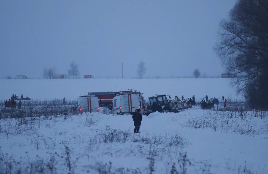 Emergency services work at the scene where a short-haul regional Antonov AN-148 plane crashed after taking off from Moscow's Domodedovo airport, outside Moscow