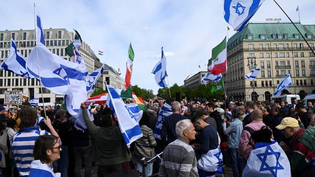 Demonstrators attend a protest after Iran launched drones and missiles towards Israel, in Berlin