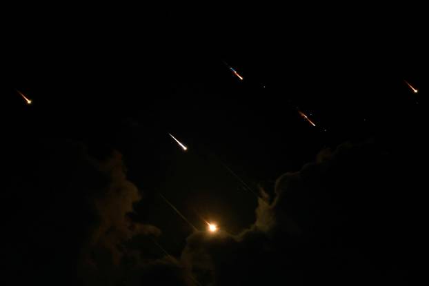 Rockets fly in the sky, amid cross-border hostilities between Hezbollah and Israel, as seen from Tel Aviv