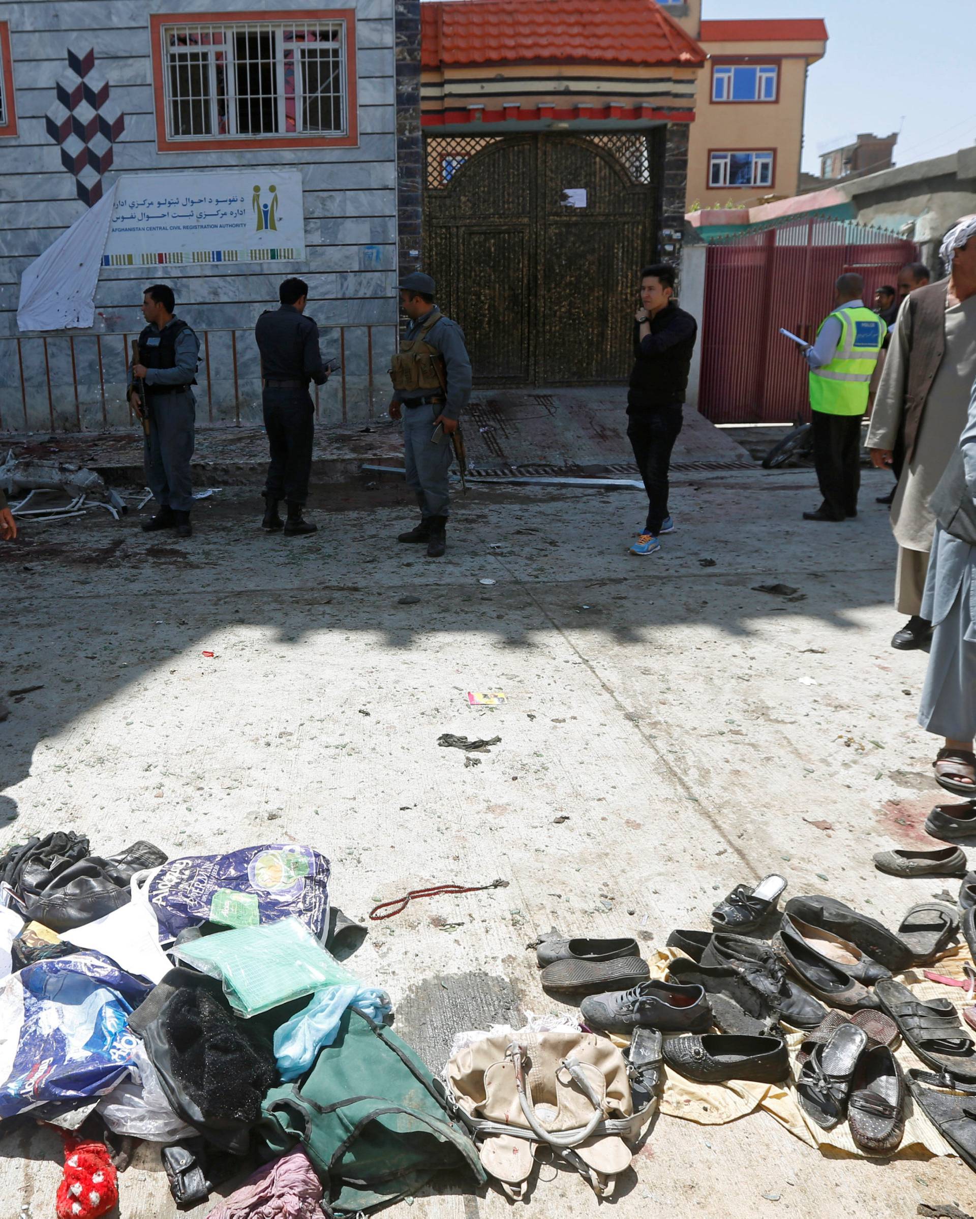 Clothes and sandals are seen at the site of a suicide bomb attack in Kabul