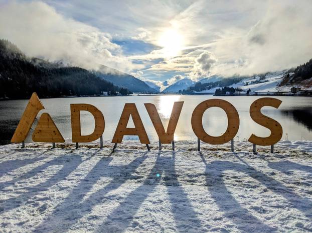 Davos Klosters Mountains. View of Lake Davos with snow. Strolling around this beautiful mountain lake in the sunshine.