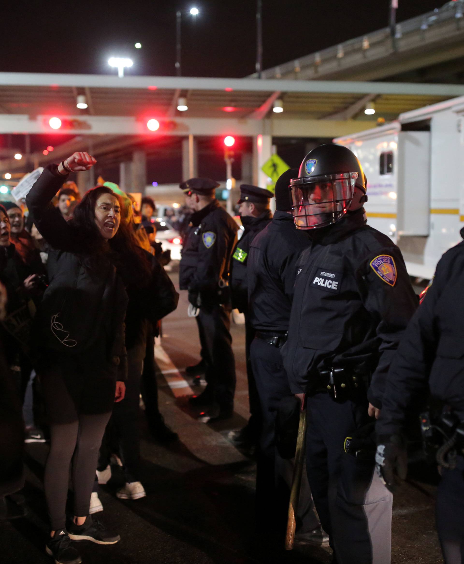 Protesters gather outside Terminal 4 at JFK airport in opposition to U.S. president Donald Trump's proposed ban on immigration in Queens, New York City, U.S.